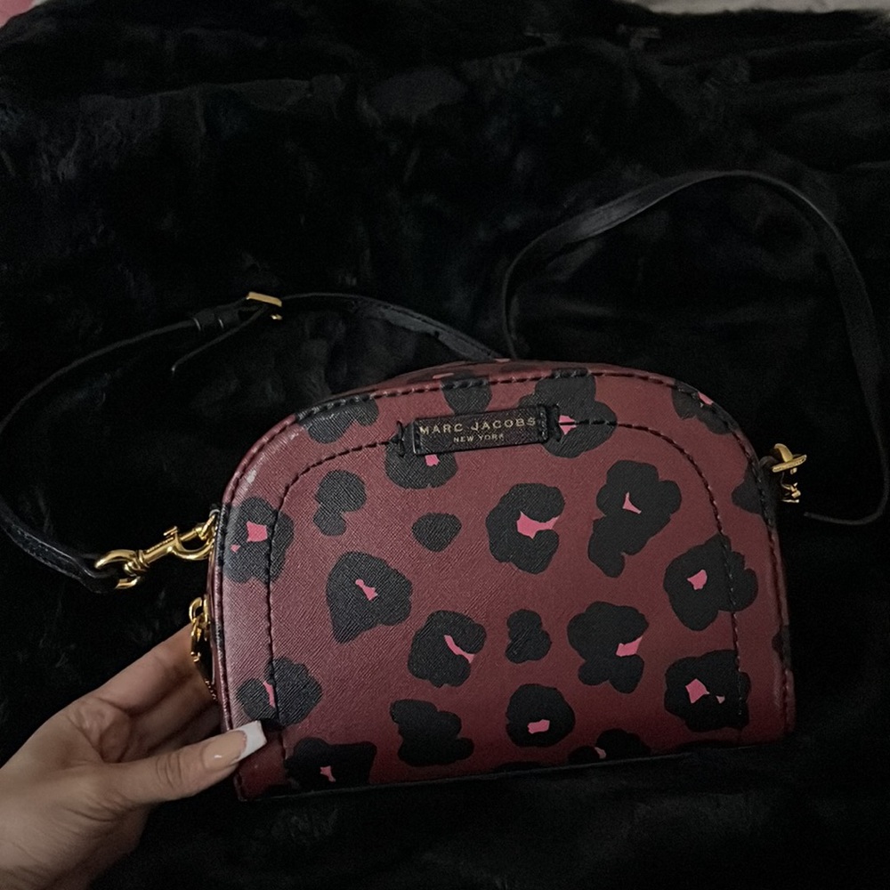 Brand: MARC JACOBS, Style: crossbody purse, Colors: burgundy, pink, black.